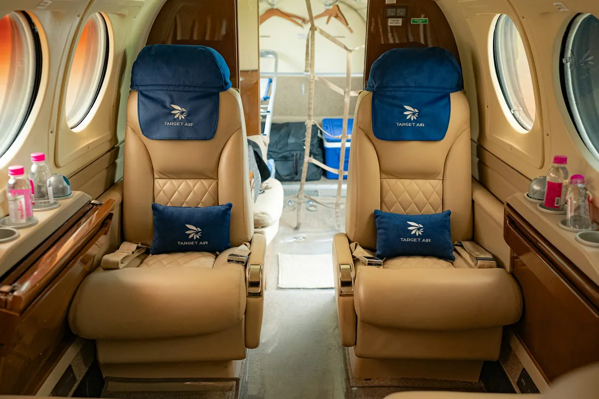 Private jet cabin with facing seats